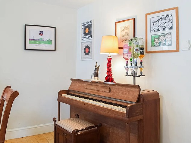 The property features prints of Wynne as the Go Compare caricature and a selection of framed records