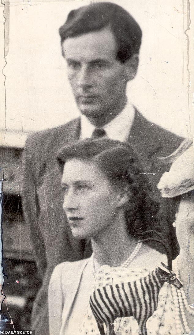 Peter stands behind Margaret during the royal tour of South Africa in 1947