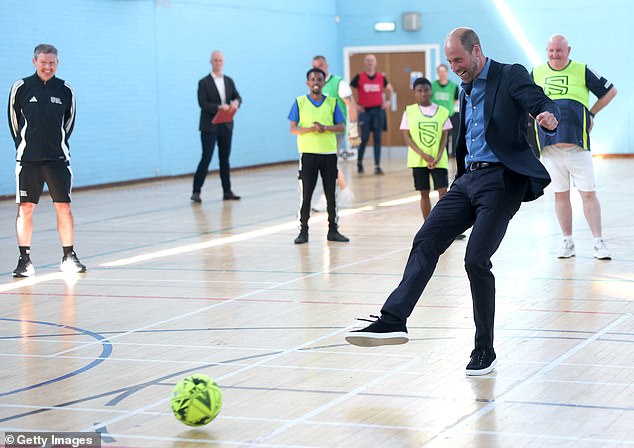 William plays football during a visit to a sports hall in Scotland. In 2013, William played football on the lawn of Buckingham Palace with Pride of Britain award winner June Kelly and legendary England striker Michael Owen on the lawn of Buckingham Palace