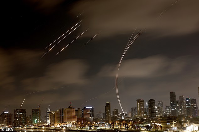 The Iron Dome, the Israeli air defense system, intercepts missiles fired from Iran, over Tel Aviv on June 18