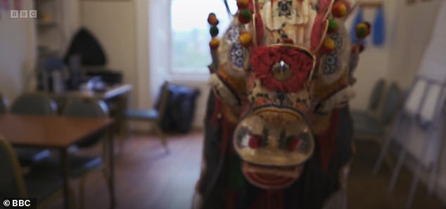 Lucia was invited to the Hakka Chinese community centre to watch Kaming perform (pictured) with the newly restored mask