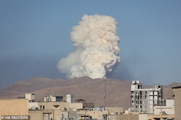 Smoke rises following an Israeli attack in Tehran yesterday