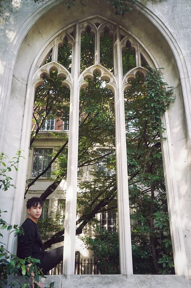In this photo, he is seen posing in the window of St Dunstan in the East, a ruined church in London