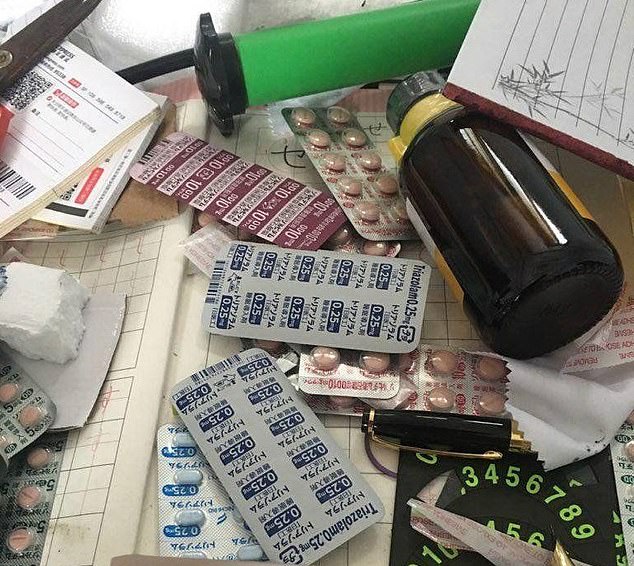 A host of different drugs in pill form were also discovered by police at Zou's residence