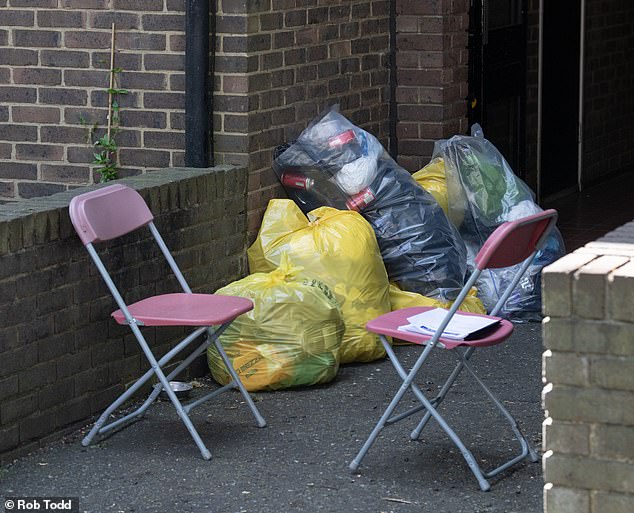 The Metropolitan Police have been hunting for her killer, who is believed to have made off with her diamond-encrusted Rolex (pictured: bags of rubbish inside the police cordon on Thursday)