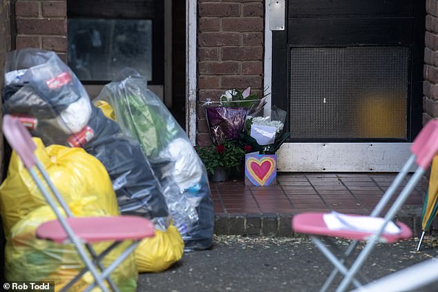 Flowers seen piled up inside the police cordon after the film director's murder