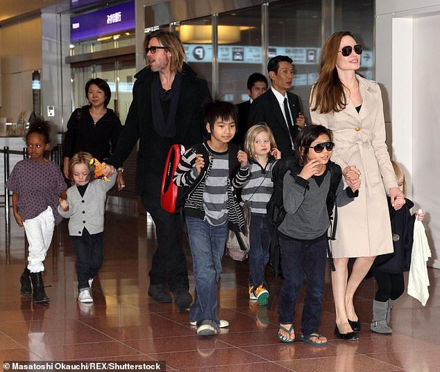 Brad Pitt escaped any real scrutiny over Angelina's highly detailed report of the abuse she claims she and the children suffered on that plane at Pitt's hands. (Pictured: Brad and Angelina with Maddox, Pax, Zahara, Shiloh, Knox and Vivienne in 2011).