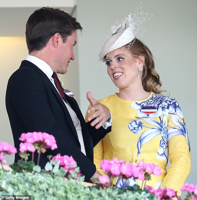 The affectionate couple were spotted laughing, pointing, gasping and even nervously biting their nails as they followed the day's action