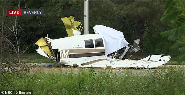 One man has died and another has been rushed to hospital with 'serious injuries' after a small plane crashed on a residential street in Beverly, on the outskirts of Boston, Massachusetts
