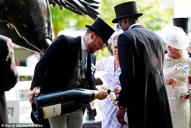 Racegoers cooled down with huge magnums of champagne on day three of the races