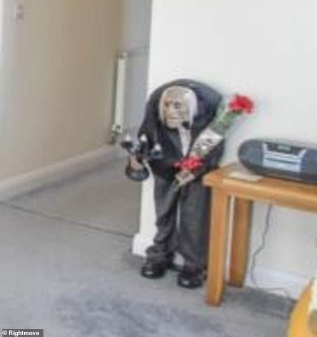 The spooky man could give some potential buyers a fright when they enter the room