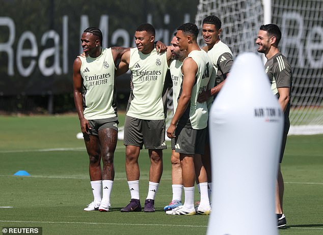 Mbappe, pictured in training on Sunday, was forced to miss Real Madrid's opening match