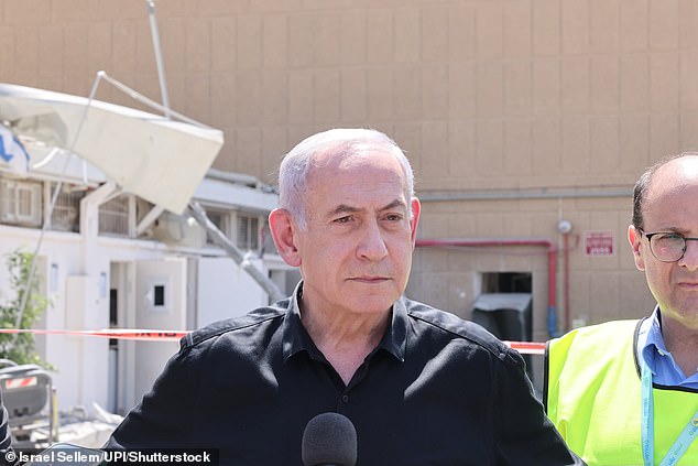 'Iran's terrorist tyrants launched missiles at Soroka Hospital and at a civilian population in the centre of the country,' he said. 'We will exact the full price from the tyrants in Tehran.' Pictured: Israeli Prime Minister Benjamin Netanyahu visits the Soroka hospital