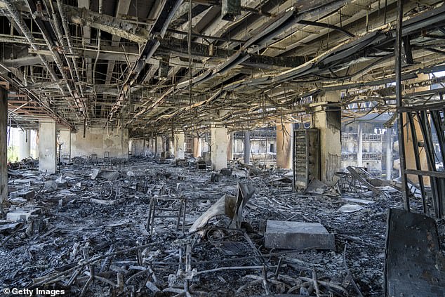 Pictured: Damaged equipment litters the floor of an office building used by the Iranian Broadcasting Organisation, hit by Israeli missiles days earlier on June 16