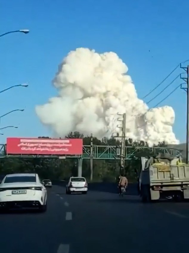 Pictured: An image claiming to show smoke rising into the sky after an Israeli strike on an inactive nuclear facility in Arak