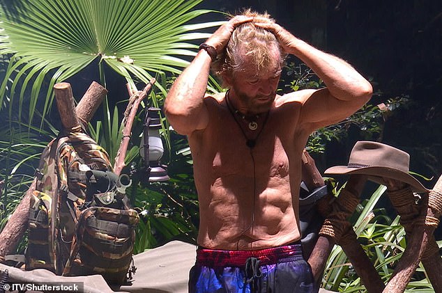 The TV star revealed the key to his secret health regime which he calls 'Tranquil Power' where you hold the weight and feel the muscle burn then let go (pictured on I'm A Celeb in 2018)