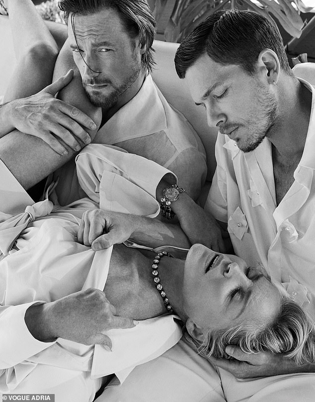A further risque snap saw the star in apparent ecstasy lying across Aubrey's lap with her legs slung over his shoulder.