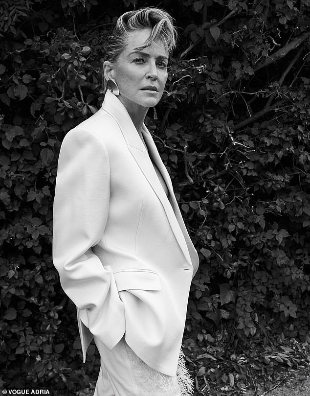The star also channeled femme fatale Trammell's power suit look as she sported a blazer with nothing underneath - as well as a coiffed hairdo