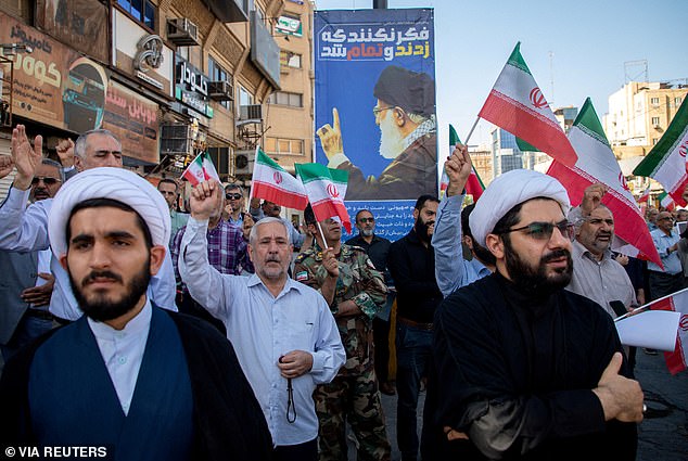Mourners are photographed on Thursday In Ahvaz, Iran at a funeral for a person killed in an Israeli airstrike as the war between Israel and Iran hits a week