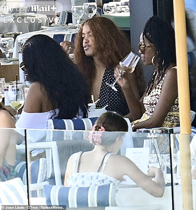 Younger sister Sasha, 24, flaunted her effortlessly style in an oversized off the shoulder white tee and a long pleated brown skirt.