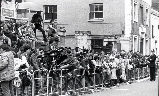 Press photographers wait outside the Lindo Wing of St Mary's Hospital following the birth of Prince William