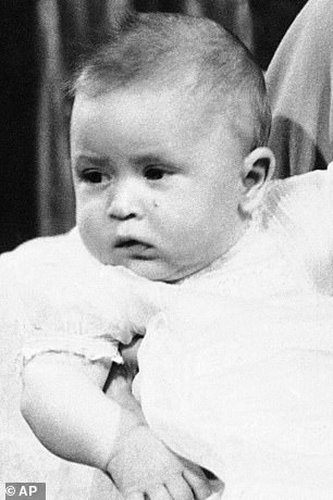 Prince Charles is pictured as a baby in Buckingham Palace in 1949