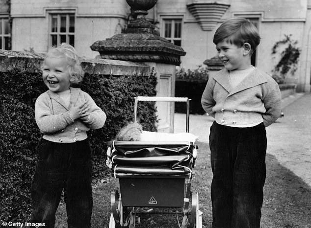 Anne and Charles got on well as children and are pictured in the grounds of Balmoral Castle in September 1952