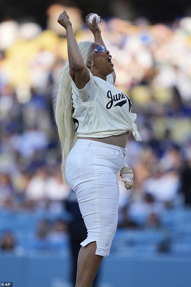 She slipped into a pair of white pumps and allowed her platinum blonde locks to flow down straight past her shoulders