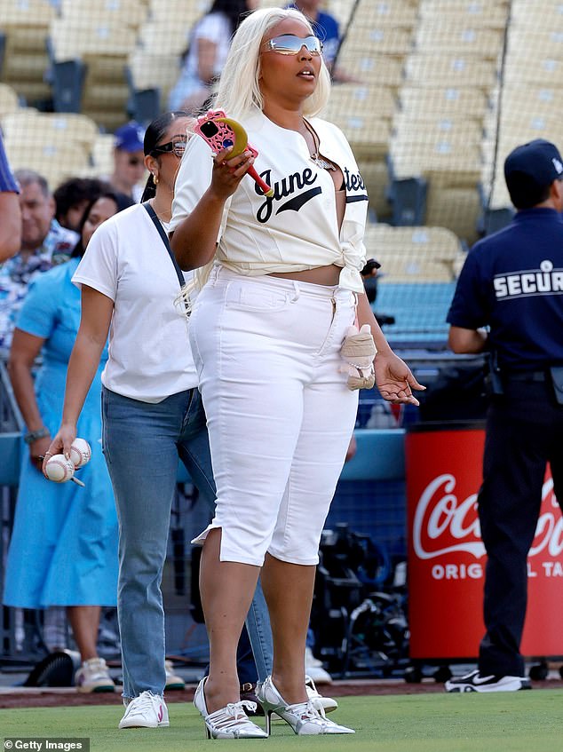 Before testing out her skills by throwing a pitch, the singer was spotted standing on one side of the baseball field at Dodger Stadium