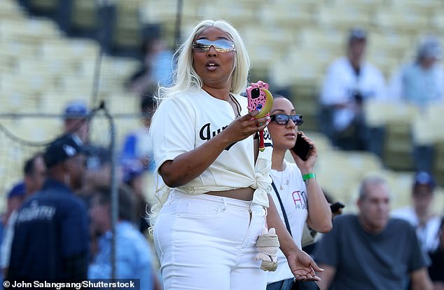 Lizzo opted to add minimal accessories to the look and also sported a pair of silver shades