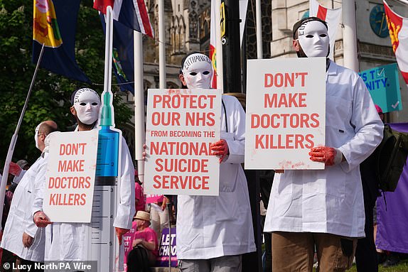 Campaigners opposing the assisted dying Bill demonstrate at Parliament Square, Westminster, central London, ahead of a debate on the Terminally Ill Adults (End of Life) Bill in the House of Commons. Picture date: Friday June 20, 2025. PA Photo. Activists from Disabled People Against Cuts (DPAC) and Not Dead Yet UK, in coalition with Disability Rights UK, Inclusion London, Together Declaration and Families Against Involuntary Medical Euthanasia (FAIME), are coming together to show opposition to the Bill. Photo credit should read: Lucy North/PA Wire