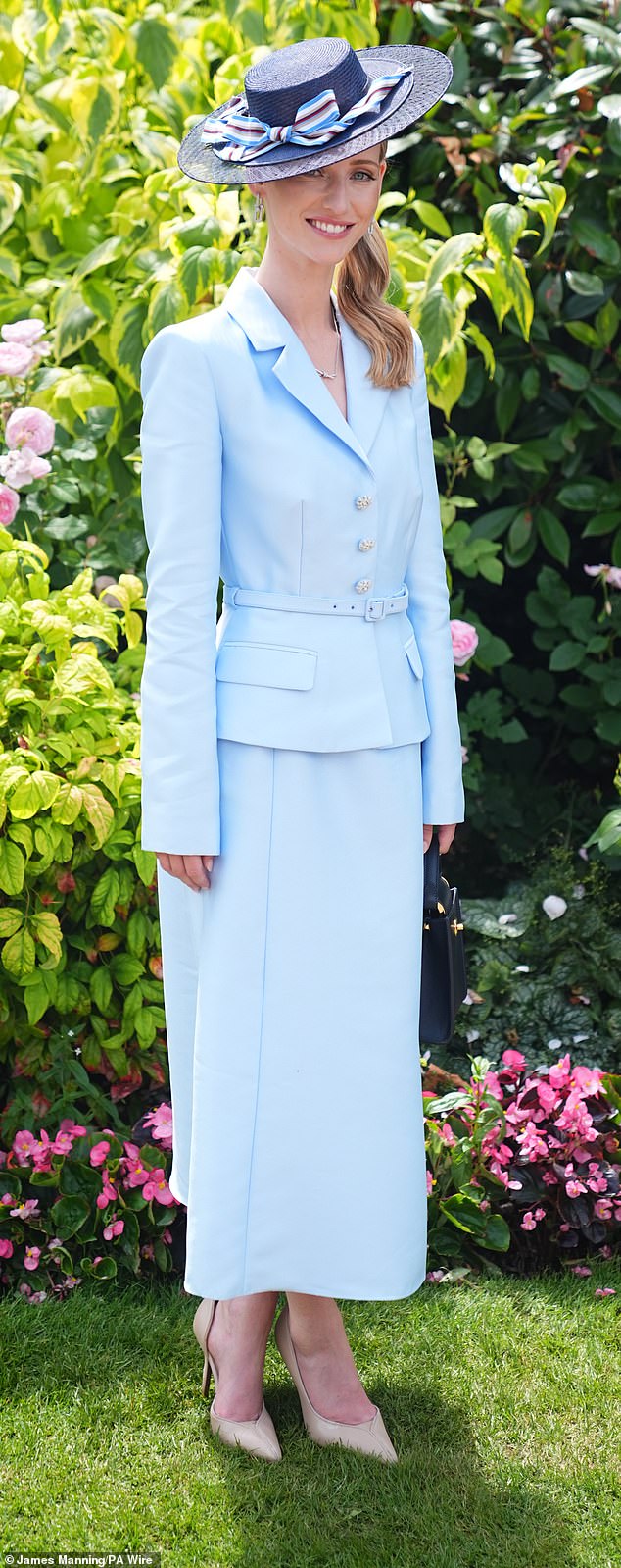 Fashion writer Flora Gibbs decided to go for a more toned-down colour and stepped out in a powder blue ensemble complete with jewelled buttons