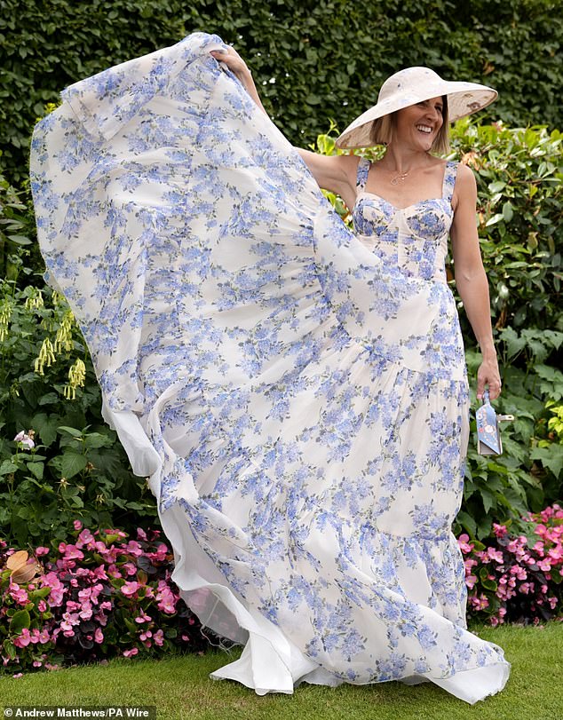 One woman showed off the extent of her white and blue floaty frock by holding it up for a picture