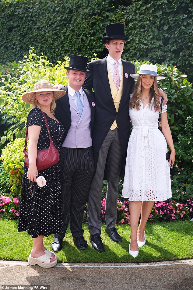 Other racegoers came prepared for the heat and the long day ahead with portable fans and wedges instead of high heels