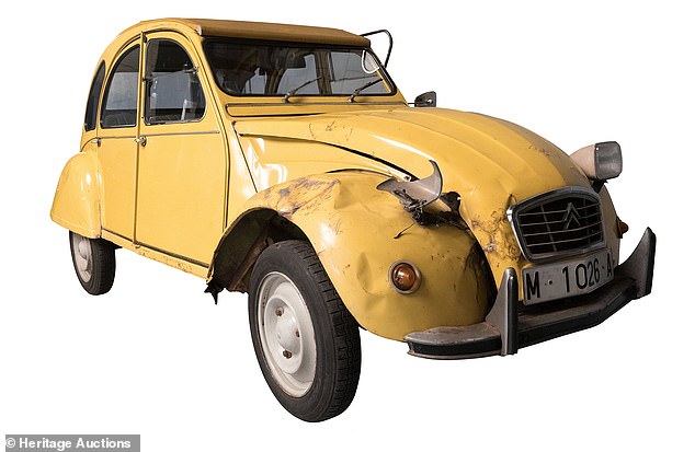 As this 2CV was rescued from a scrapyard, it has been fitted with replacement but faithful period yellow doors and boot lid, yellow roof, and seats