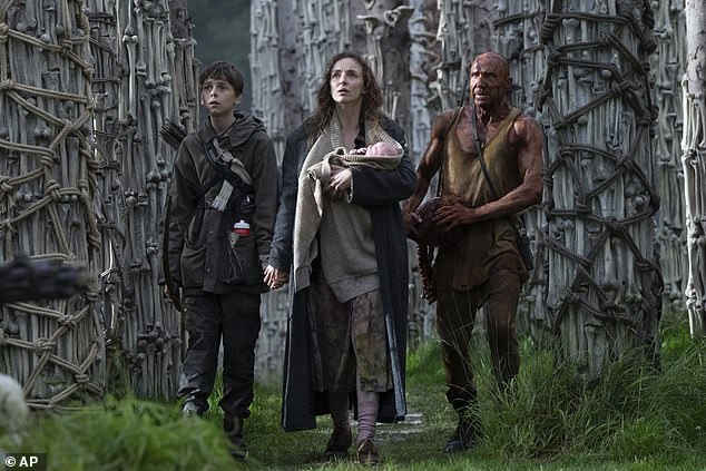 The new zombie horror movie has received a heap of positive reviews from critics following early screenings (Alfie, Jodie Comer and Ralph Fiennes are pictured in the movie)