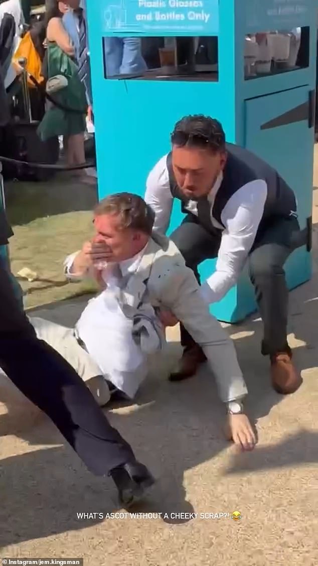 While one man, dressed in a grey suit, was dragged away, the other was picked up from the ground with blood gushing from his face