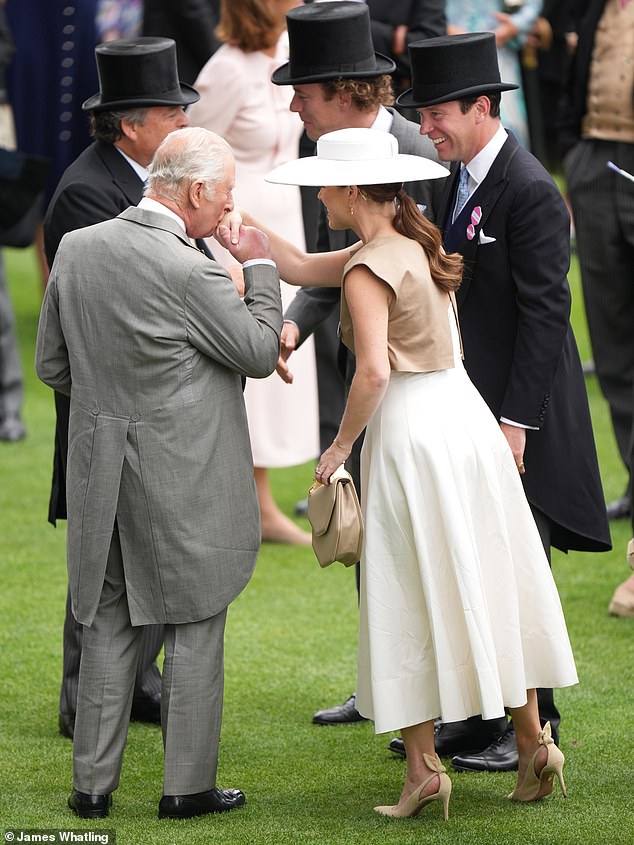 The King was full of affection on Friday as he kissed the hand of his niece Princess Eugenie