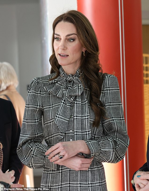 The princess wore her high street favourite, a dogtooth checked mini dress from Zara with puffed sleeves and a pussybow detail