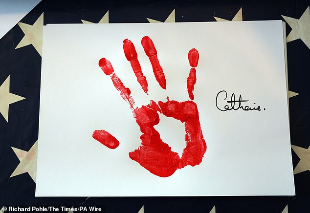 A royal work of art! the Princess made a piece of artwork out of her painted handprint and signed it with 'Catherine'