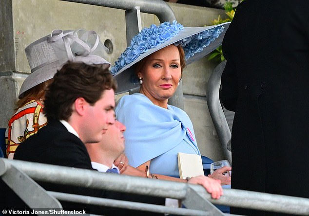 She donned a pale blue dress paired with an extravagant floral fascinator in the same shade and big black sunglasses.