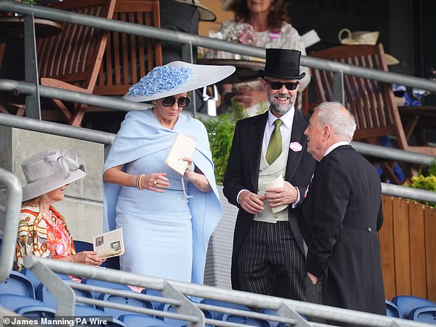 Neil sported a top hat and tails with a pale green waistcoat and a pair of sleek black shades