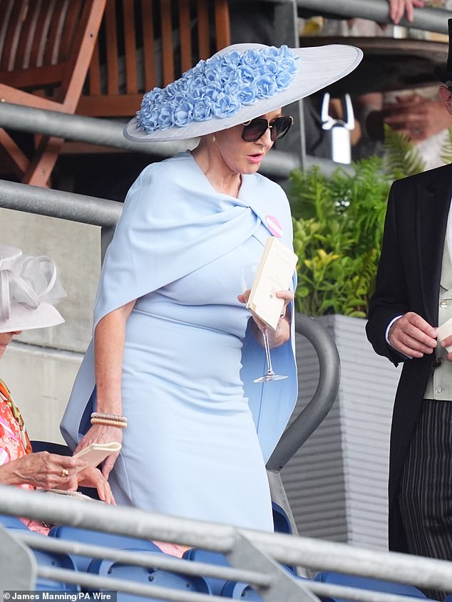 Ms Rowling looked elegant in her sky blue frock at Ascot today as she enjoyed the races with her husband