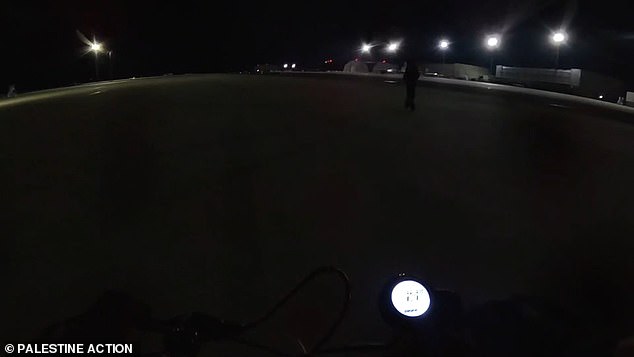 Footage shows two protesters riding electric scooters across the runway at RAF Brize Norton