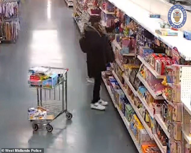 The couple were seen browsing in a supermarket aisle before tpicking up a packet of animal masks