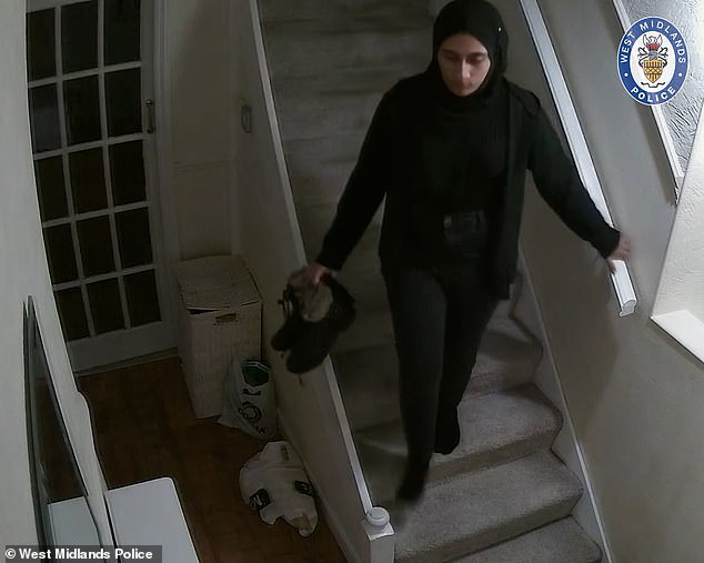 Tabussum is seen walking down the stairs - carrying her shoes - before leaving the house