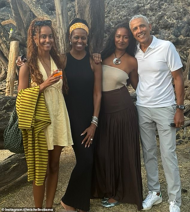Michelle and Barack have been married for almost 33 years but have faced ongoing rumors about their marriage status over the last several months. The couple are pictured with their daughters Malia and Sasha