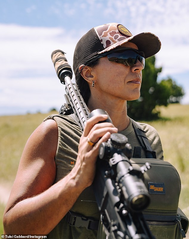 Gabbard posing with a rifle on her social media