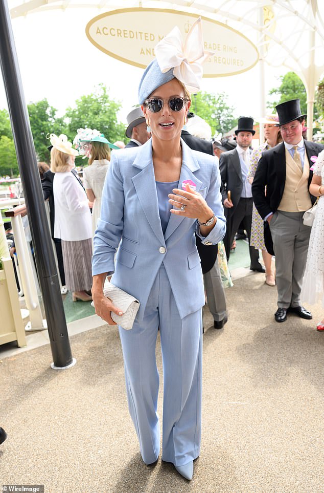 Zara, 44, finished off the chic look with a pair of pointed blue heels, sunglasses and a white patterned clutch bag