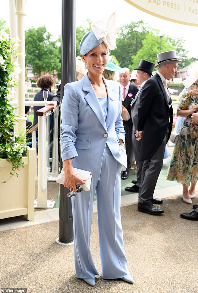 Zara, 44, finished off the chic look with a pair of pointed blue heels, sunglasses and a white patterned clutch bag